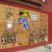 A wall with various images painted on it.