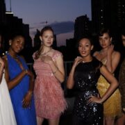 A group of women standing next to each other.