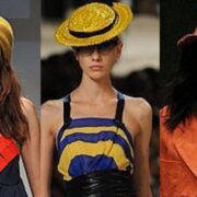 A group of women wearing hats and looking like they are dressed in the same style.