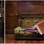 A woman sitting on top of a couch with her legs crossed.