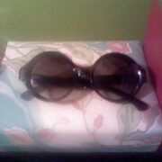 A pair of sunglasses sitting on top of a box.