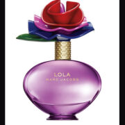 A bottle of perfume with a flower in it.