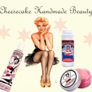 A pin up girl sitting on the ground with other items.