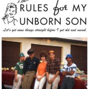 A group of people sitting on top of a red couch.