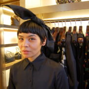 A woman with black hair and a bunny ear.